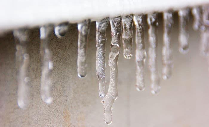 Frozen icicles on house