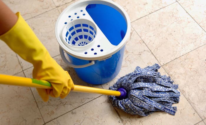 Cleaning the floor with a mop